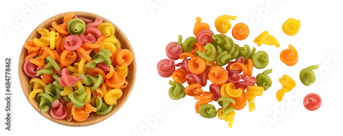 Raw colored pasta in wooden bowl isolated on white background with full depth of field. Top view. Flat lay