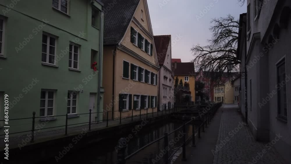 Memmingen, Germany, December 5, 2022: DOLLY SHOT - The picturesque Stadtbach (Town Brook) of Memmingen, a town in Swabia, Bavaria, Germany. Memmingen, Germany, December 5, 2022: DOLLY SHOT - The picturesque Stadtbach (Town Brook) of Memmingen, a town in Swabia, Bavaria, Germany.