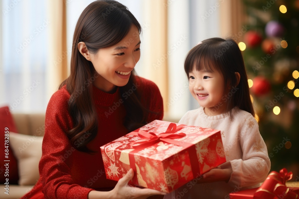 A Joyful Christmas Moment: Mother and Daughter Exchanging Gifts
A Joyful Christmas Moment: Mother and Daughter Exchanging Gifts
