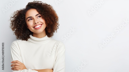Grinning meditative lady having an thought, grinning tricky feeling interested, standing on white divider photo