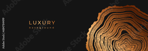 Luxury golden background with wood annual rings texture. Banner with shiny tree ring pattern. Stamp of tree trunk in section. Natural wooden concentric circles. Black and bronze gold background 