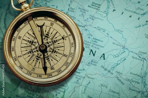 Magnetic retro old compass and world map.