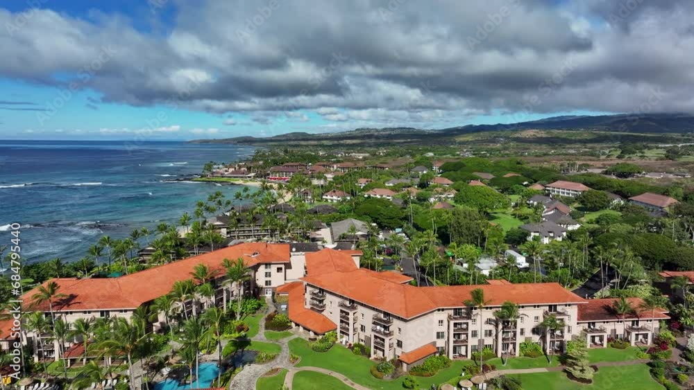 Aerial Kauai Hawaii beach condominium homes shoreline. Expensive luxury homes, resort, condominium and golf club near coast. Recreation and tourism. Economy tourism based. Tourist enjoy warmth. Aerial Kauai Hawaii beach condominium homes shoreline. Expensive luxury homes, resort, condominium and golf club near coast. Recreation and tourism. Economy tourism based. Tourist enjoy warmth.