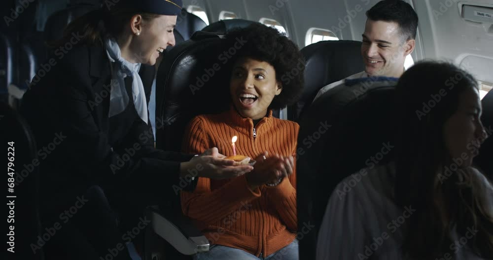 happy birthday during a flight in a airplane with surprice special romantic cake and candle for celebrating the anniversary together with love and tenderness with friends.