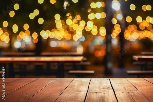 Wooden table in front of blurred background of cafe or restaurant.