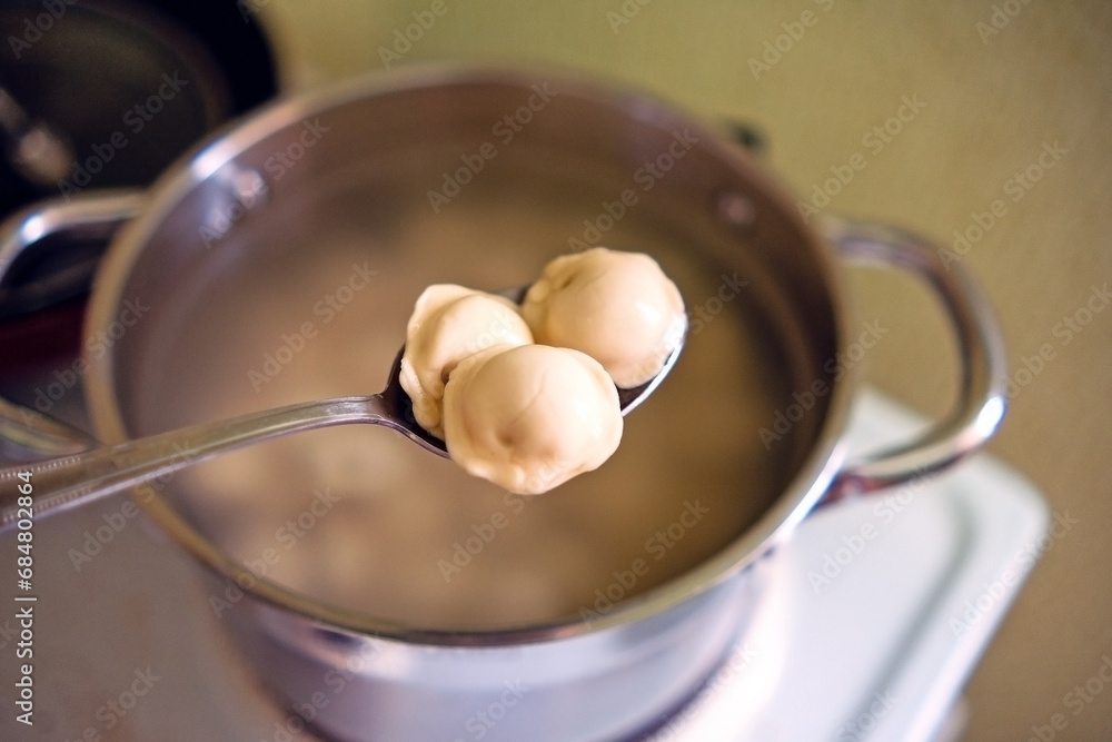 Undercooked dumplings on a spoon Undercooked dumplings on a spoon
