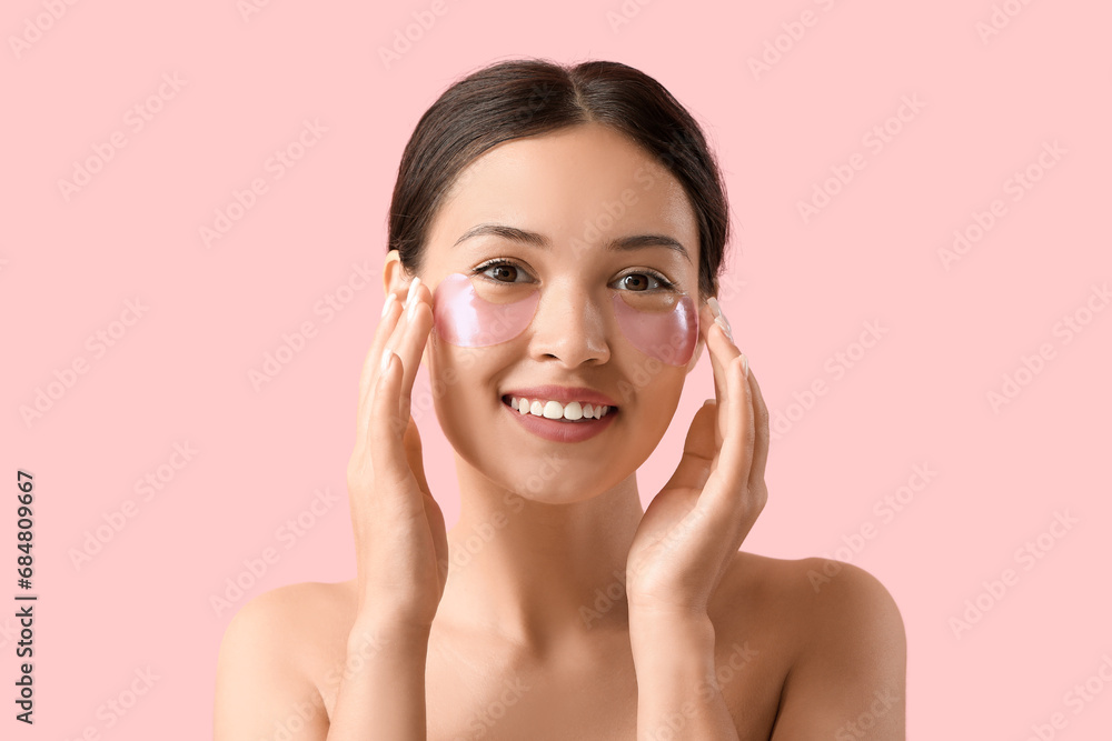 Beautiful Asian woman with under-eye patches on pink background, closeup Beautiful Asian woman with under-eye patches on pink background, closeup