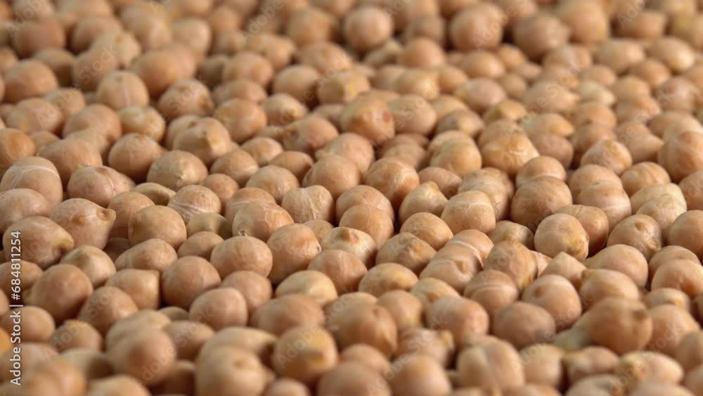 Dry chickpeas or dried garbanzo beans rotating on plate background side view. Ingredient for falafel. Cicer arietinum Dry chickpeas or dried garbanzo beans rotating on plate background side view. Ingredient for falafel. Cicer arietinum