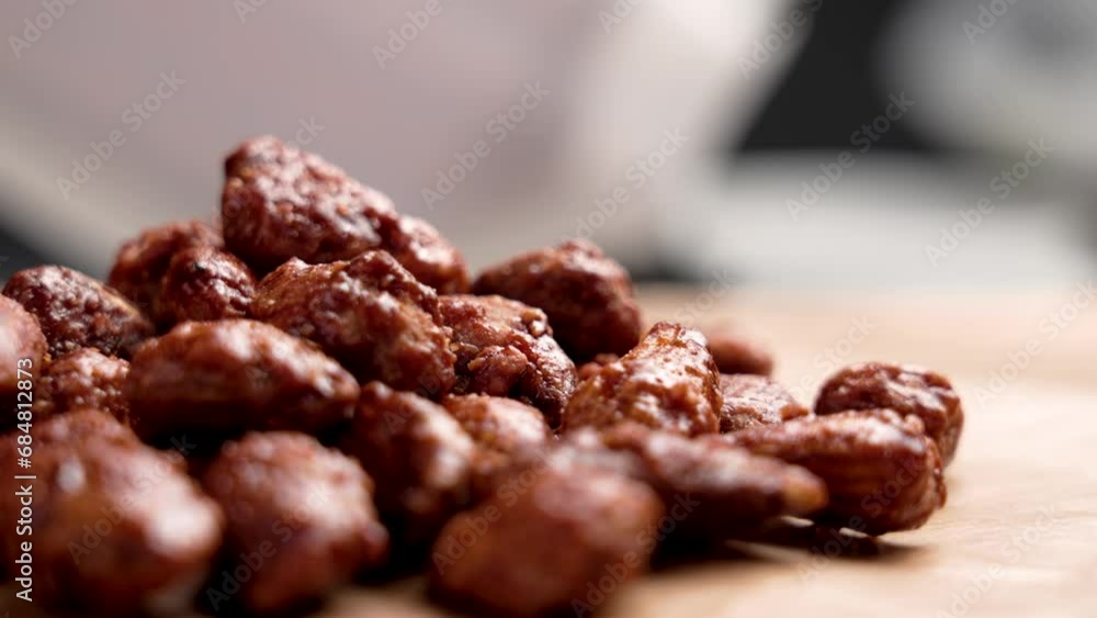 A pile of Christmas sweets made from candied almonds on the kitchen table close up. Rotation A pile of Christmas sweets made from candied almonds on the kitchen table close up. Rotation