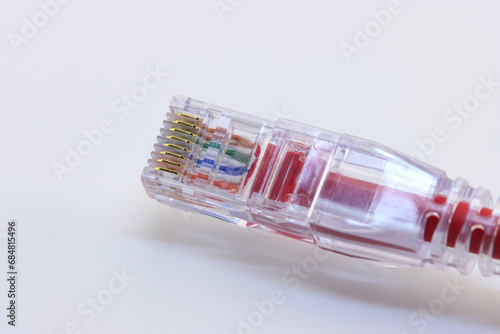 RJ45 connector for connecting an Ethernet signal. On a white background, close-up.
