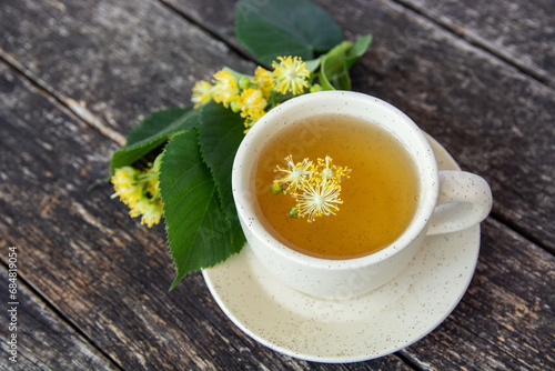 cup of herbal linden tea with honey and lemon. doctor treatment and prevention of immune concept, medicine - folk, alternative, complementary, traditional medicine