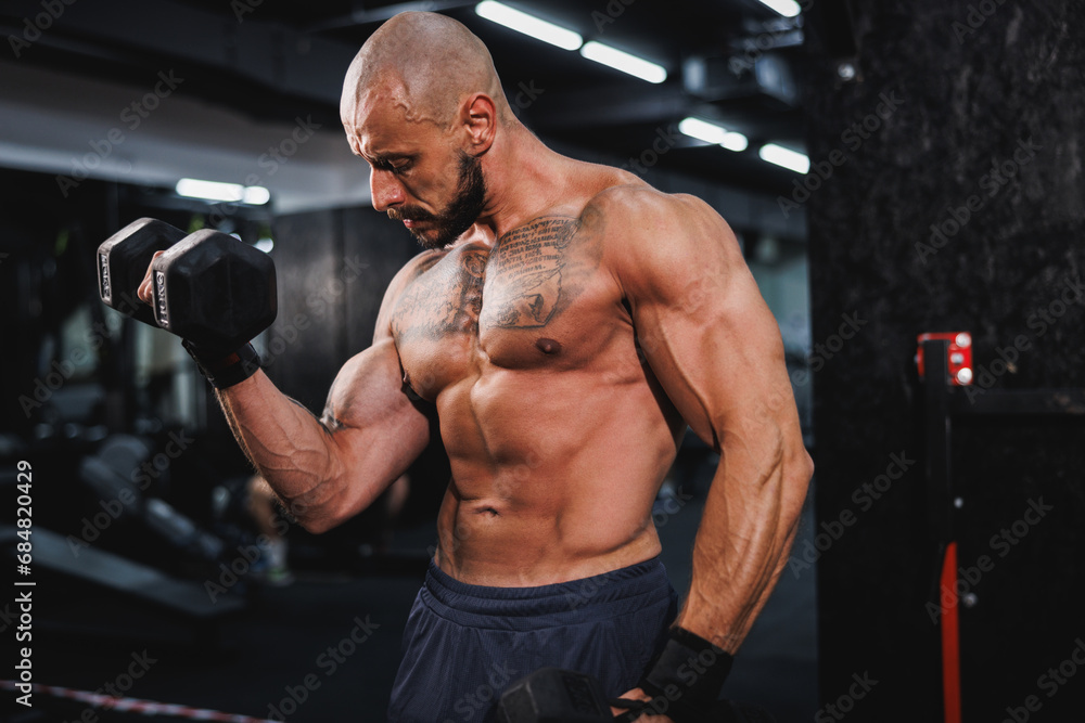 Man Doing Training With Dumbbell For His Arms Muscle At The Gym Man Doing Training With Dumbbell For His Arms Muscle At The Gym