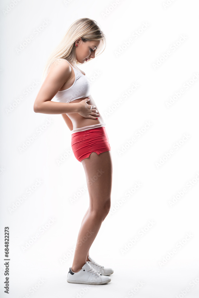 Fototapeta premium woman Checks physical condition mid-workout