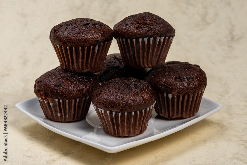 chocolate muffins with chocolate,Chocolate muffins stacked in a stack, tasty and fragrant