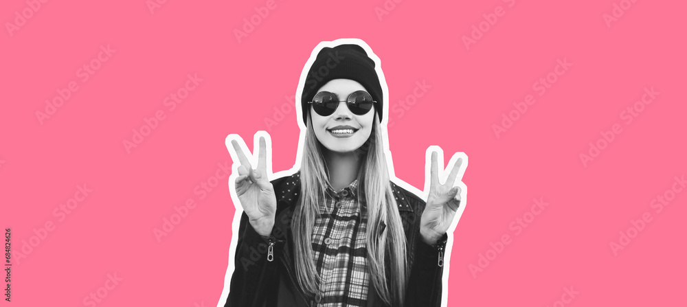 Fashion portrait of happy smiling blonde young woman posing in rock black style on pink studio background, magazine style Fashion portrait of happy smiling blonde young woman posing in rock black style on pink studio background, magazine style