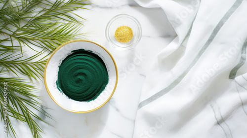 Top view of green spirulina powder, a biological natural supplement for immunity and health. Spirulina lowers cholesterol and blood pressure.  photo