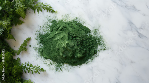 Top view of green spirulina powder on marble table, a biological natural supplement for immunity and health. Spirulina lowers cholesterol and blood pressure. 