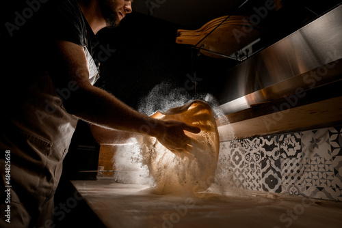 Pizza dough tossing technique by the chef