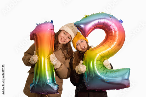фотографія Girlfriends are holding large inflatable numbers 12 twelve