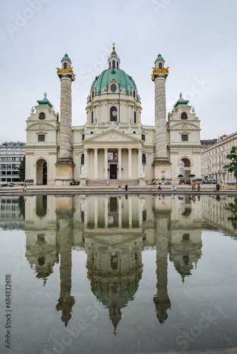 Vienna, Austria. Facade of the St. Charles Church (Karlskirche) reflected in the pond of the Resselpark. Vertical Image. 