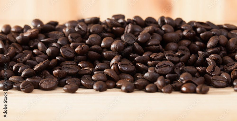 Fototapeta premium Image of fresh coffee beans on natural wooden background, nobody