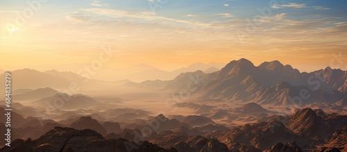 Mount Sinai, situated in Egypt's Sinai Peninsula, offers a breathtaking view at dawn. It is also known as Jebel Musa, associated with the Ten Commandments and Moses. photo