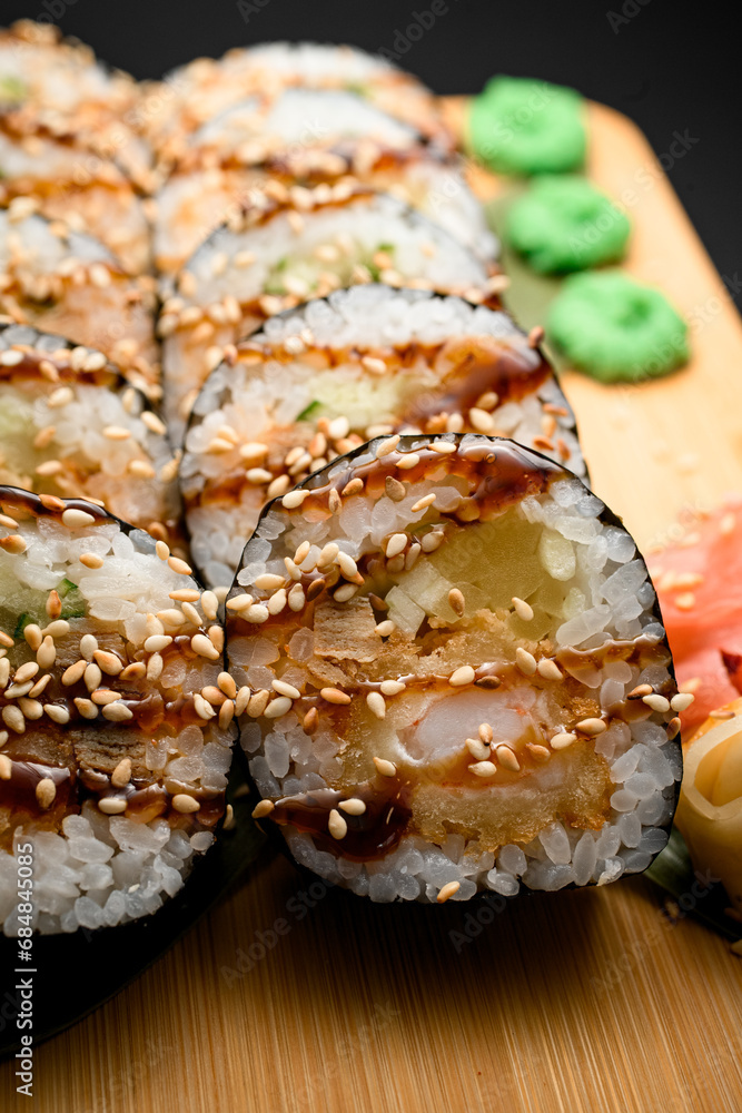 Sushi set with sesame, brown soy sauce, tuna, white rice, and nori Sushi set with sesame, brown soy sauce, tuna, white rice, and nori