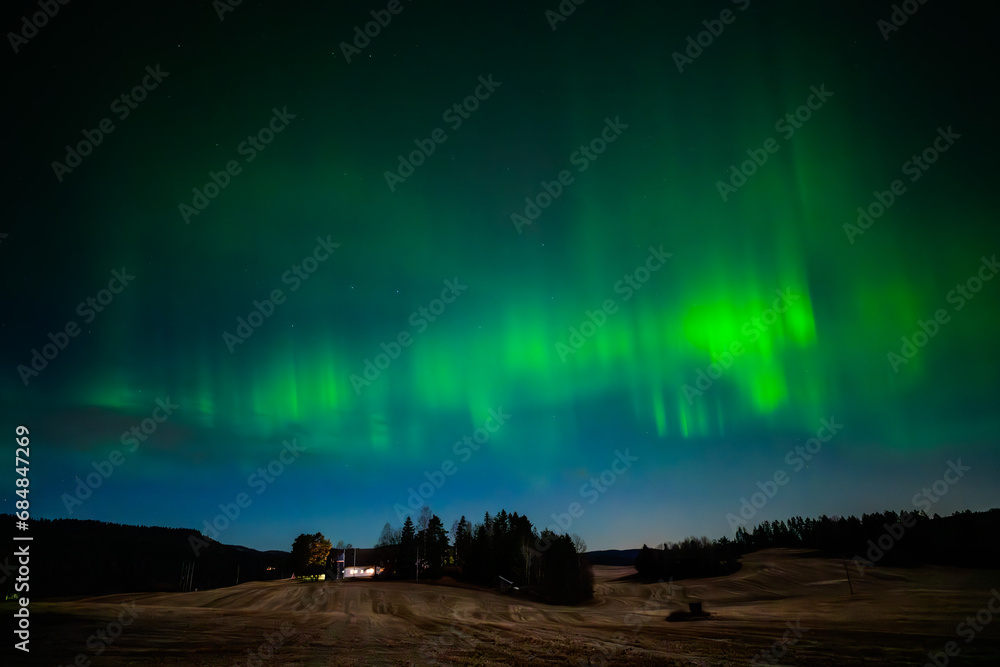 Beautiful aurora borealis lightens up the sky