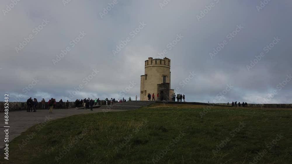 County Clare, Ireland, August 26, 2023: The O'Brien's Tower marks the highest point of the Cliffs of Moher. The tower was built on the cliffs in 1835 by the local landlord and MP Sir Cornelius O’Brien County Clare, Ireland, August 26, 2023: The O'Brien's Tower marks the highest point of the Cliffs of Moher. The tower was built on the cliffs in 1835 by the local landlord and MP Sir Cornelius O’Brien