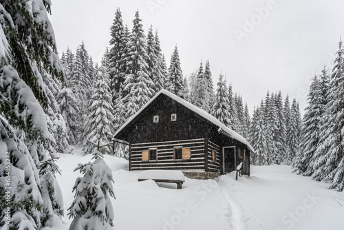 Small wooden hut in winter Jizera Mountains, Czechia © pyty