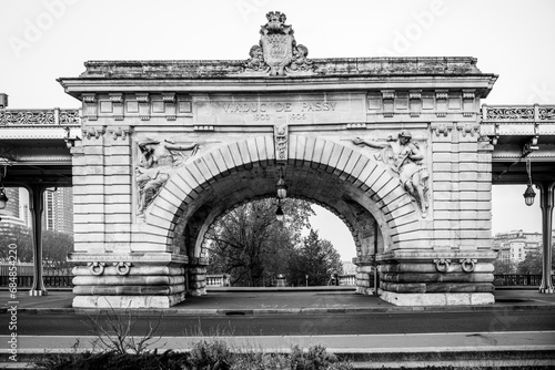 Central arch of historical Bir Hakeim Bridge in Paris, France. Black and white image. photo