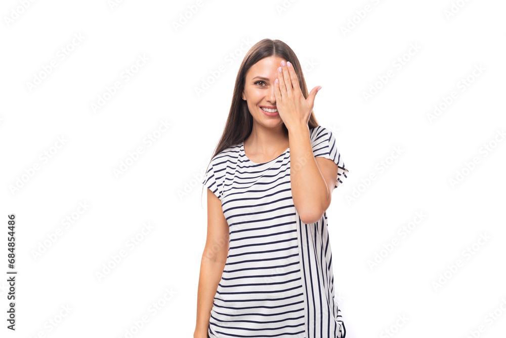 young positive pretty european brunette woman in a striped t-shirt on a white background with copy space young positive pretty european brunette woman in a striped t-shirt on a white background with copy space
