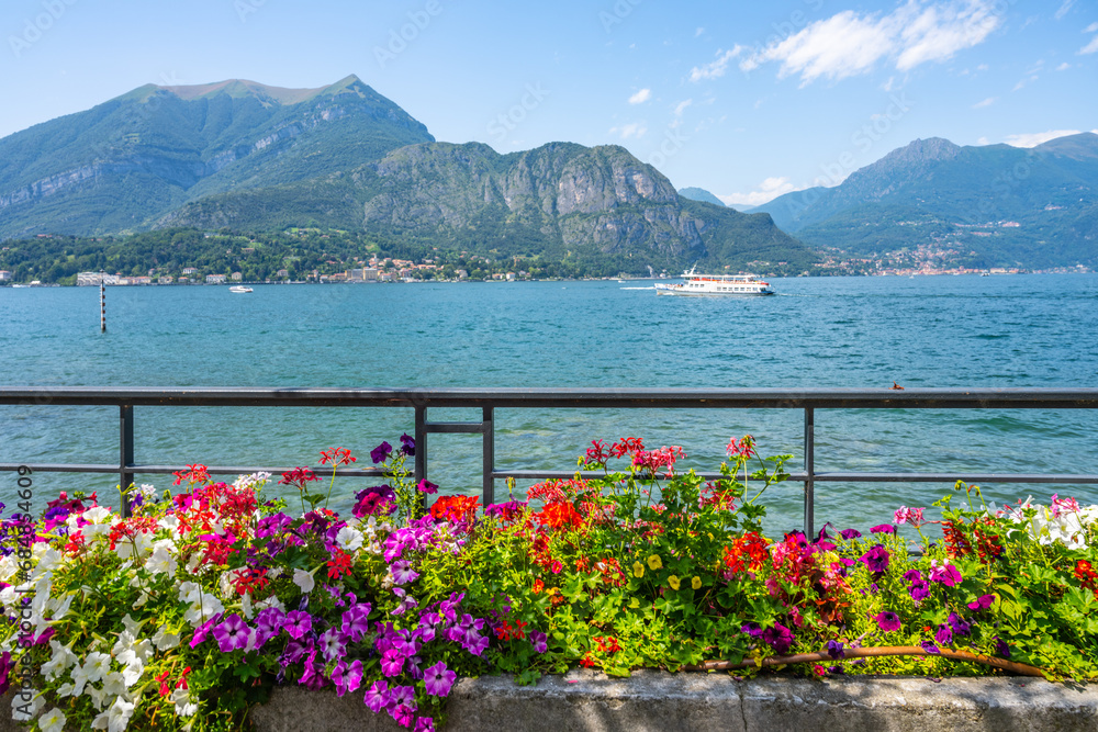 Blooming trees and flowers at Bellagio lakeshore promenade. Como Lake, Lombardy, Italy