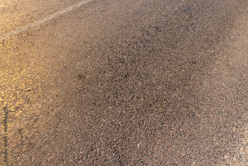 a part of an asphalt highway in close-up a part of an asphalt highway in close-up