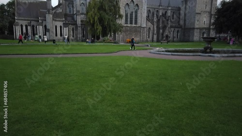 Dublin, Ireland, August 27, 2023: TILT SHOT - Saint Patrick's Cathedral and Collegiate Church, founded in 1191 as a Roman Catholic cathedral, view from St. Patrick’s Park. photo