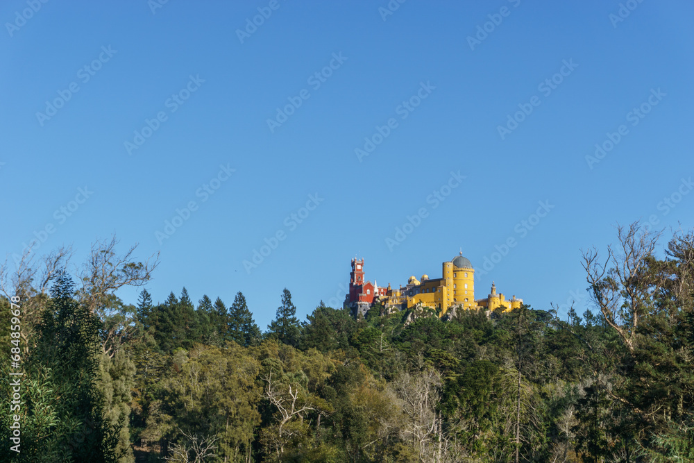 Palace of Pena on top of a hill between forest in Sintra. Lisbon, Portugal