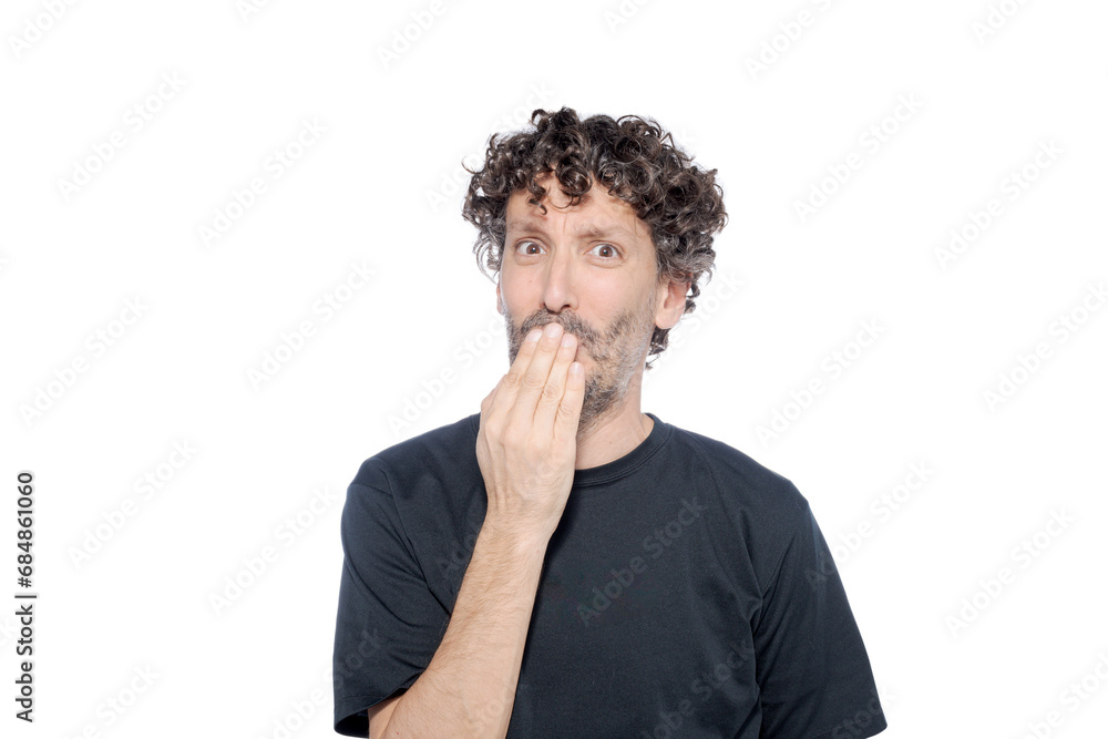 Man on white background covering his mouth with a gesture of surprise. Man on white background covering his mouth with a gesture of surprise.