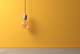 A light bulb hanging above a wall