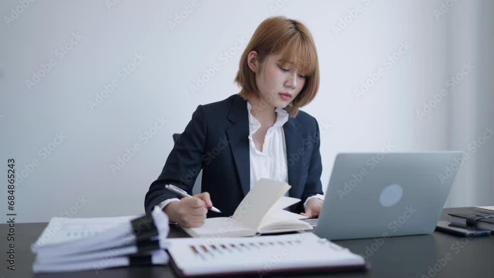 Female secretary worker working on office desk searching about data paper. Female secretary worker working on office desk searching about data paper.