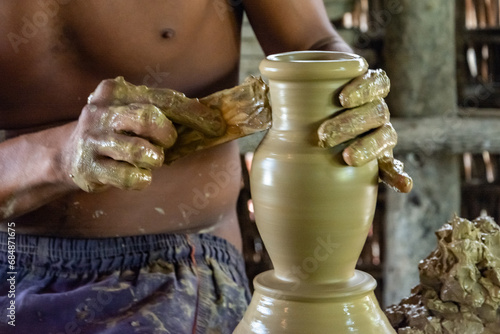 An artisan is seen making ceramic works in Maragogipinho in the city of Aratuipe, Bahia. photo