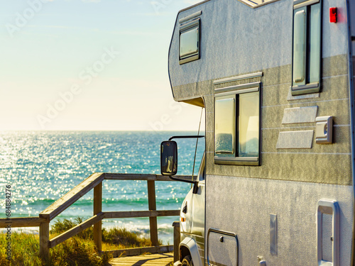 Camper rv camping on sea shore, Spain photo