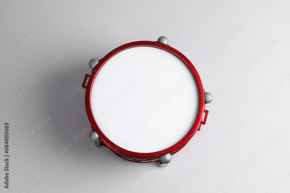 Fototapeta premium Drum on light background, top view. Percussion musical instrument
