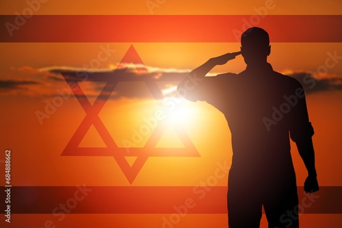 Silhouettes of soldiers on the background Israel flag. photo