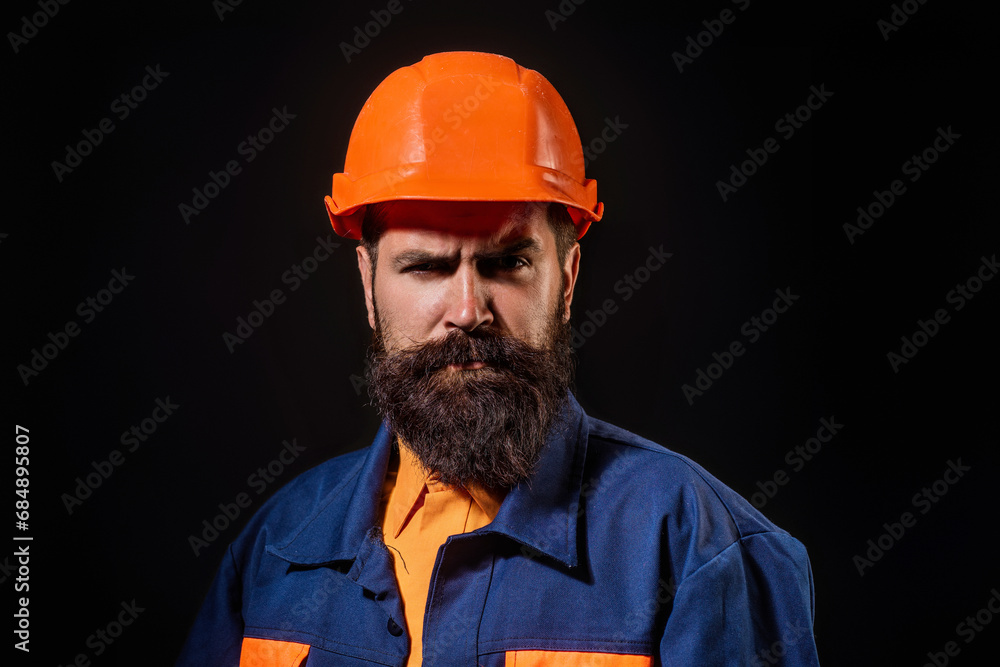 Serious funny builder worker. Handyman builder in hardhat. Building concept. Builder foreman. Man in helmet studio portrait. Engineer worker in hardhat. Construction site manager. Serious funny builder worker. Handyman builder in hardhat. Building concept. Builder foreman. Man in helmet studio portrait. Engineer worker in hardhat. Construction site manager.