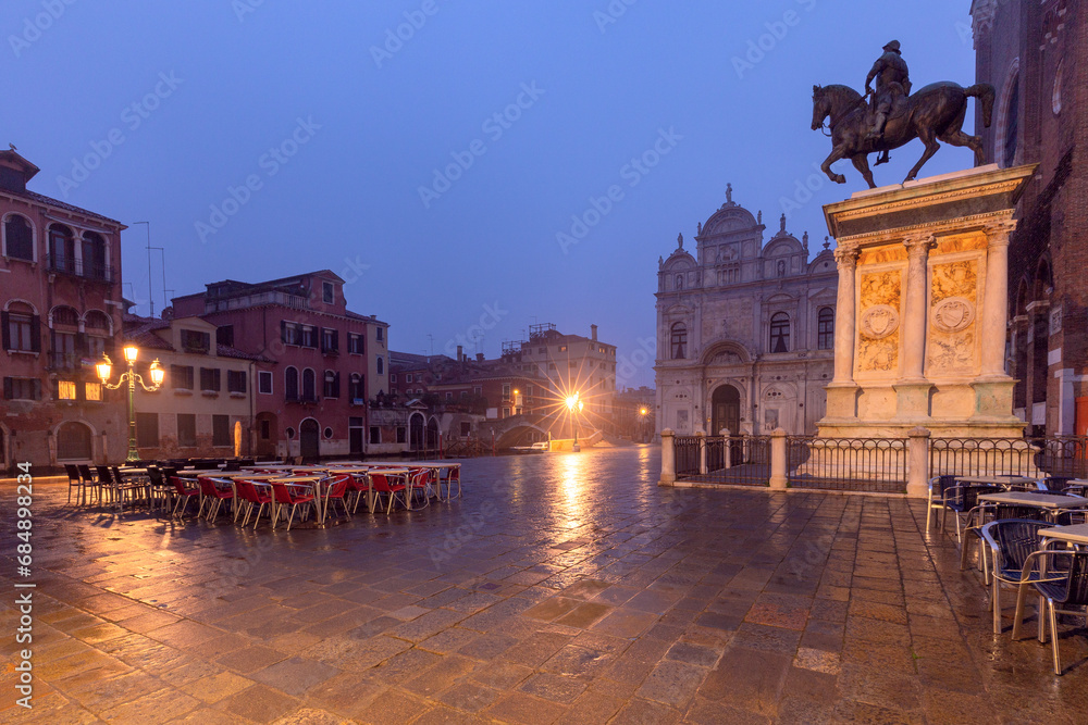 Piazza Santi Giovanni e Paolo illuminated at night at dawn. Venice.