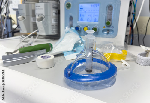 laryngoscope, ventilator, intubation kit, endotracheal tube, oral airway, laryngeal mask, crucial for respiratory support and airway management in hospital settings photo