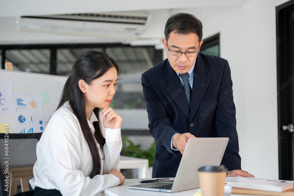 Professional team of business people working together in the office room, prepare for the next meeting. Professional team of business people working together in the office room, prepare for the next meeting.