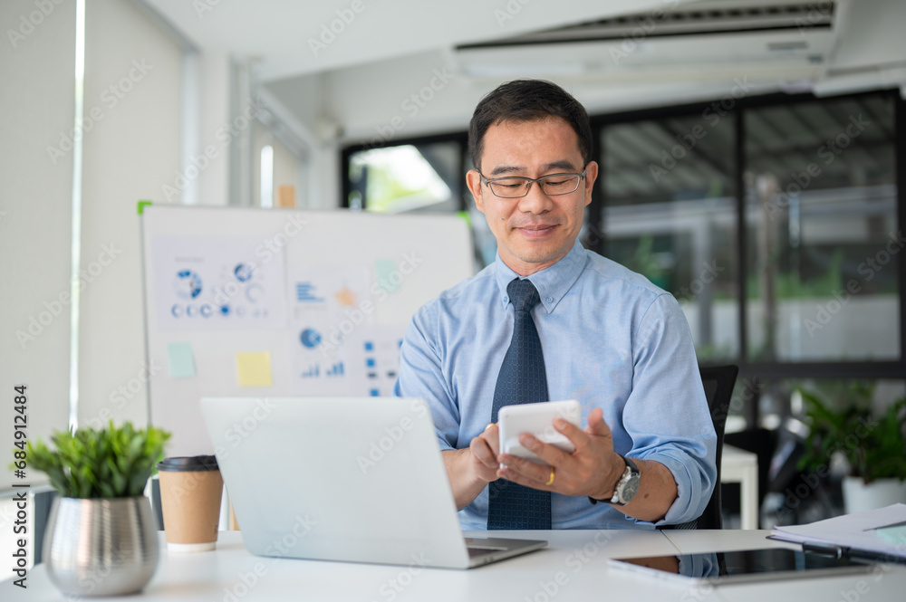 Experienced senior businessman working with calculator, managing the budget of the project. Experienced senior businessman working with calculator, managing the budget of the project.