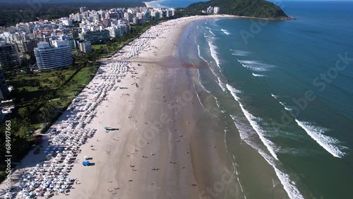 Flying over Riviera de São Lourenço beach, Sao Paulo, Brazil, during summer. photo