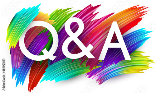 Questions and answers paper word sign with colorful spectrum paint brush strokes over white.